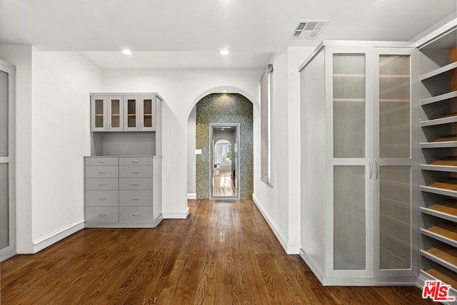 hall featuring dark wood-type flooring