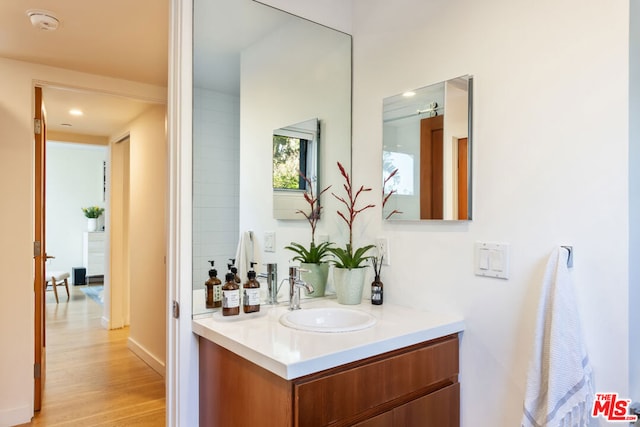 bathroom with vanity and hardwood / wood-style floors