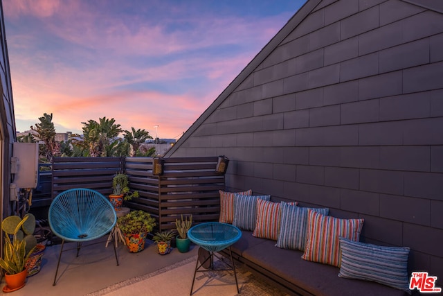 view of patio terrace at dusk