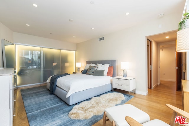 bedroom featuring light hardwood / wood-style floors