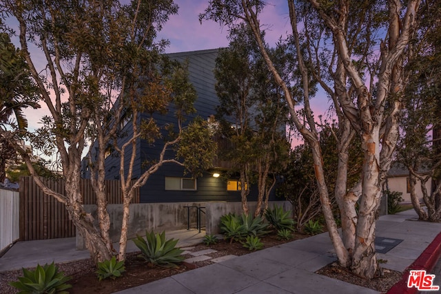 view of patio terrace at dusk