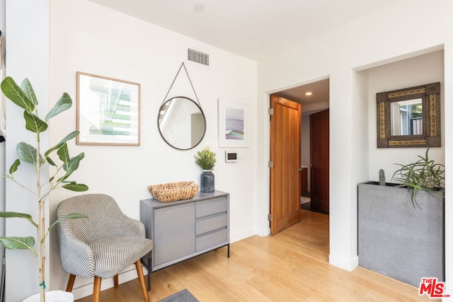 sitting room featuring light wood-type flooring