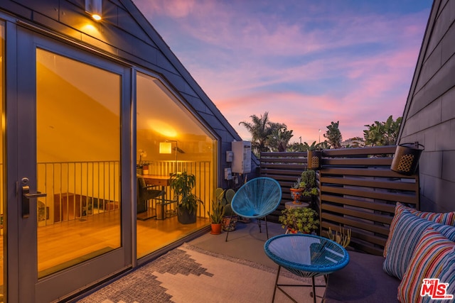 view of patio terrace at dusk