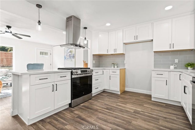 kitchen featuring white cabinetry, island exhaust hood, decorative light fixtures, and stainless steel gas stove