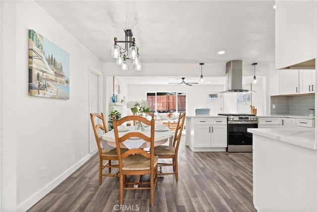 dining room featuring dark wood-type flooring and a chandelier