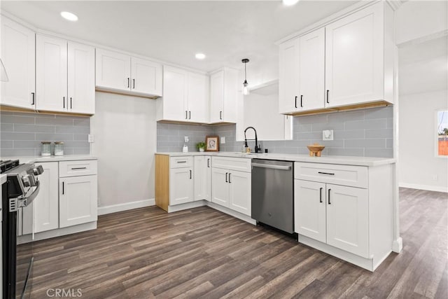 kitchen featuring hanging light fixtures, dishwasher, stove, and white cabinets