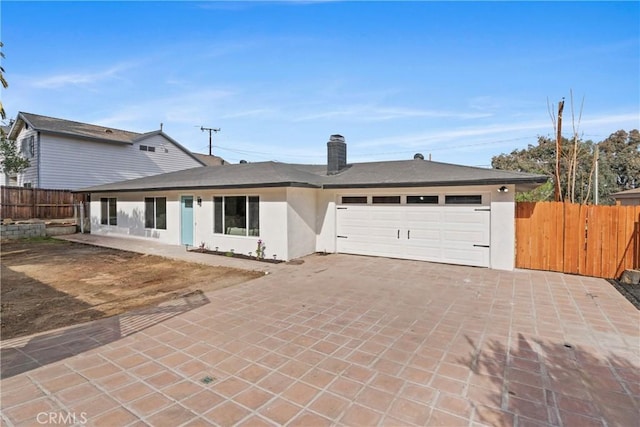 ranch-style home with a garage