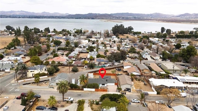 birds eye view of property featuring a water and mountain view