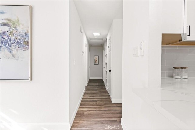 hallway featuring hardwood / wood-style flooring