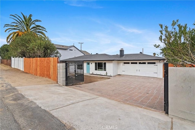 ranch-style house featuring a garage