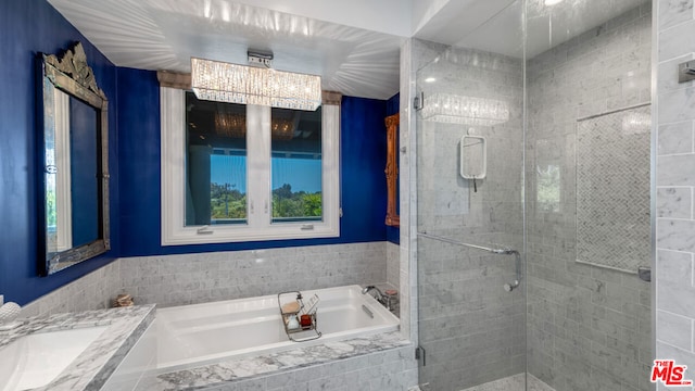 bathroom with vanity and separate shower and tub