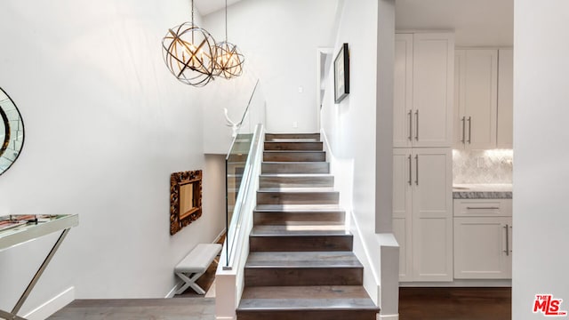 stairway featuring wood-type flooring