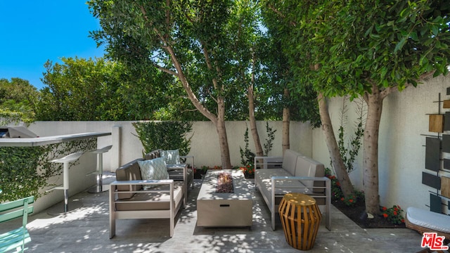 view of patio / terrace featuring an outdoor living space and a baseboard heating unit