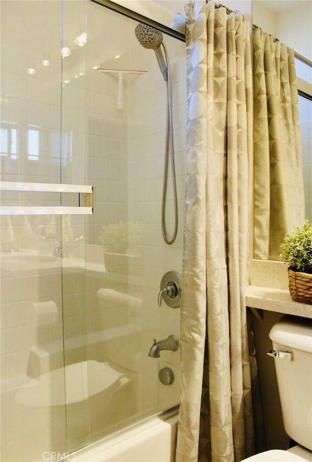 bathroom featuring toilet and shower / bathtub combination with curtain