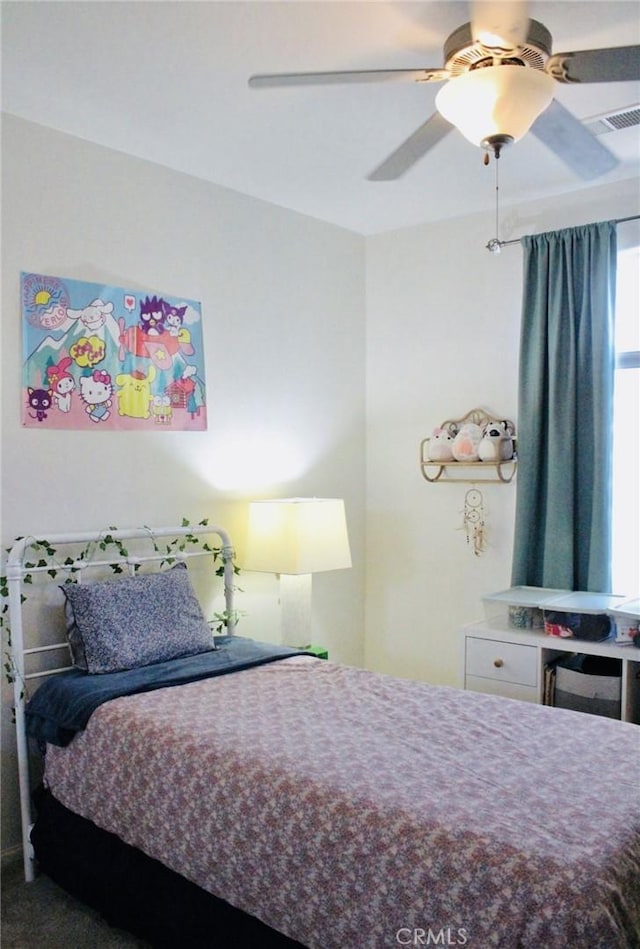 bedroom featuring a ceiling fan and visible vents