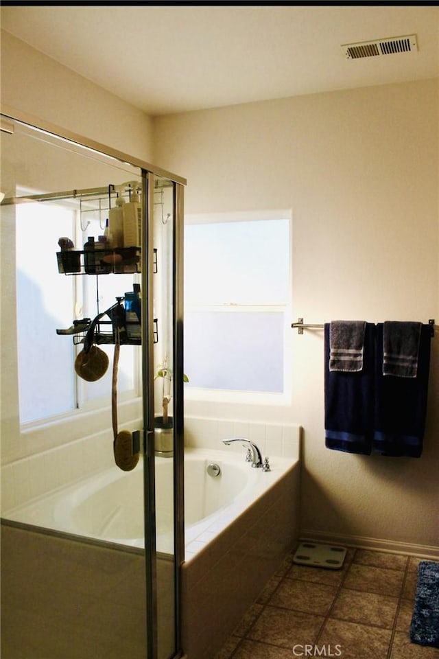 full bath with a stall shower, tile patterned flooring, visible vents, and a garden tub