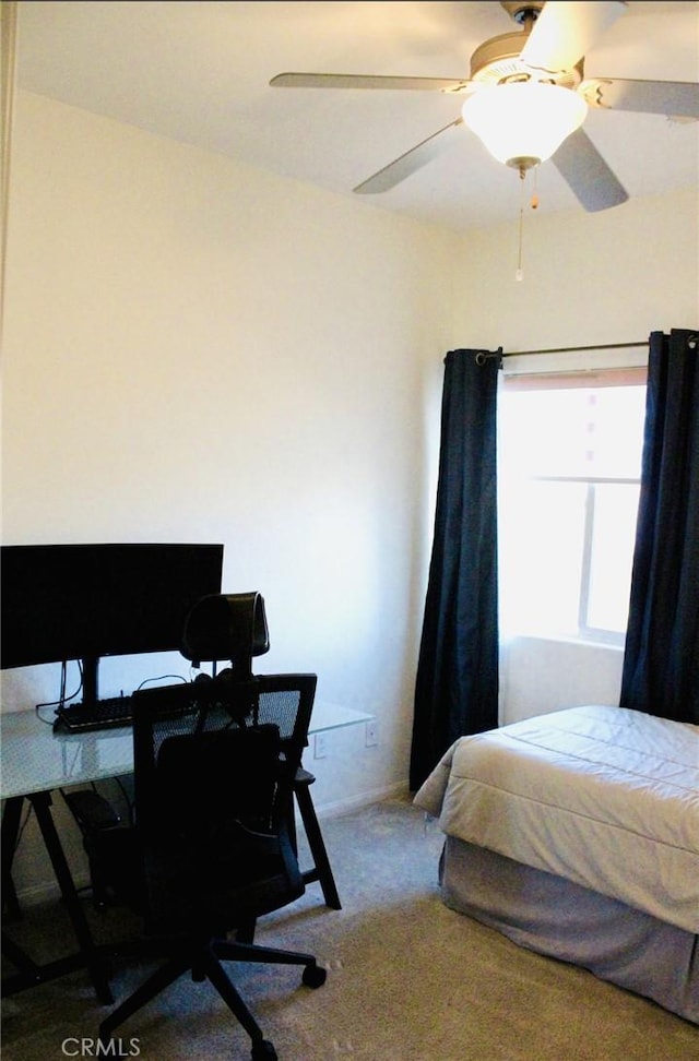 bedroom with ceiling fan and carpet