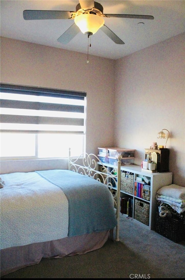 carpeted bedroom featuring a ceiling fan