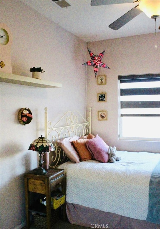 bedroom with a ceiling fan and visible vents