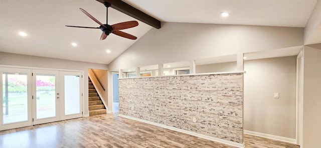 spare room with beamed ceiling, a ceiling fan, wood finished floors, recessed lighting, and stairway