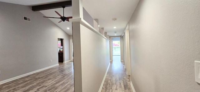 hallway featuring visible vents, beamed ceiling, wood finished floors, recessed lighting, and baseboards