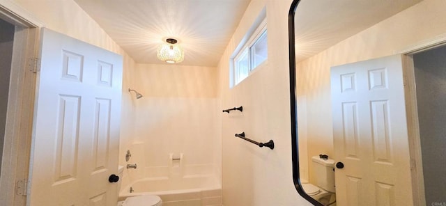 bathroom with toilet and shower / bathtub combination