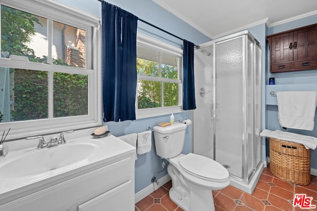 bathroom featuring ornamental molding, a shower with shower door, tile patterned floors, and sink