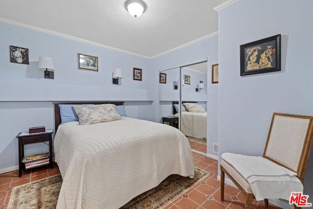 bedroom featuring ornamental molding and a closet