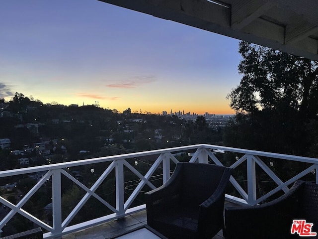 view of balcony at dusk