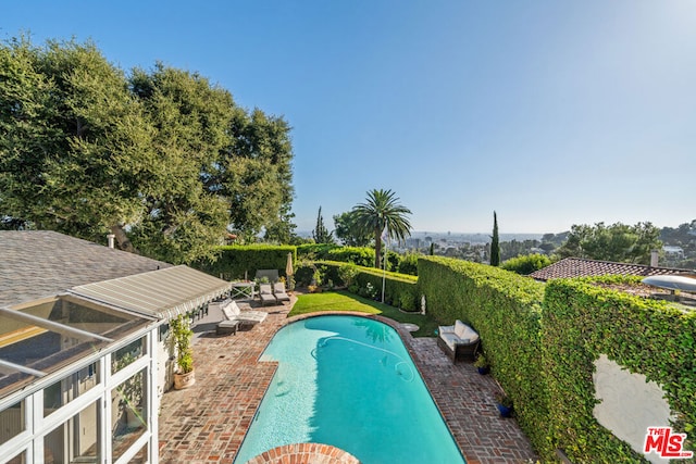 view of pool featuring a patio area