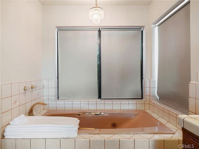 bathroom featuring tiled bath