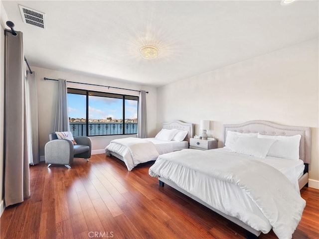 bedroom featuring dark wood-type flooring