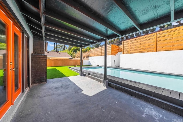 view of patio featuring french doors and a fenced in pool