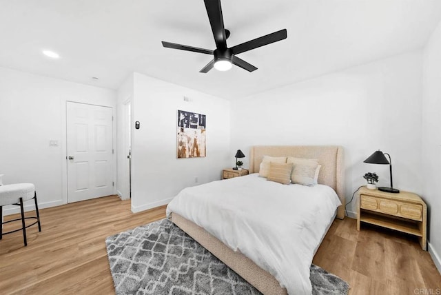 bedroom with ceiling fan and wood-type flooring