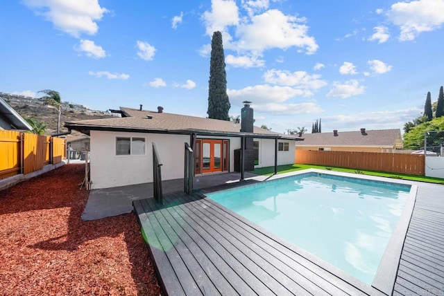 view of pool featuring french doors