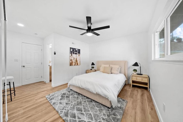 bedroom featuring wood-type flooring and ceiling fan