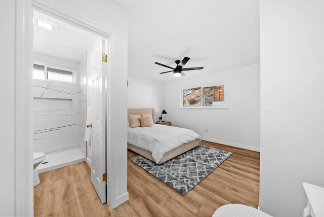 bedroom with multiple windows, wood-type flooring, and ceiling fan