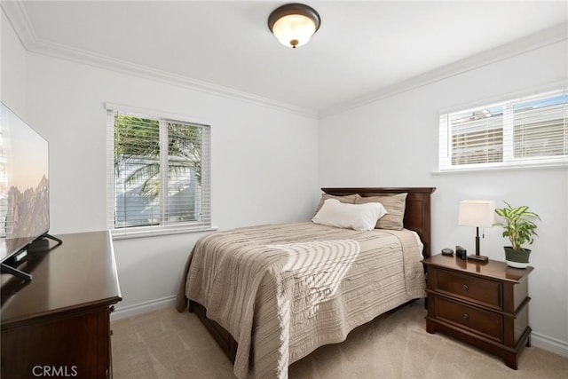 bedroom featuring light carpet, baseboards, and ornamental molding