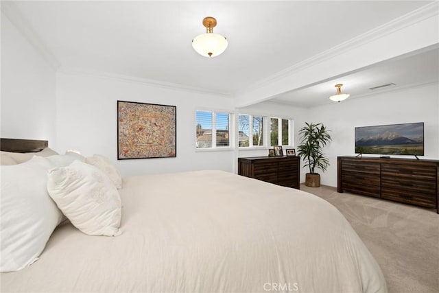 carpeted bedroom featuring crown molding and visible vents