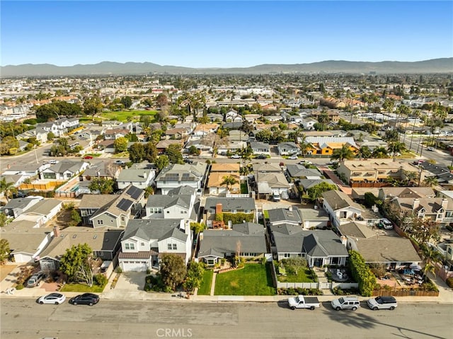 birds eye view of property featuring a mountain view and a residential view