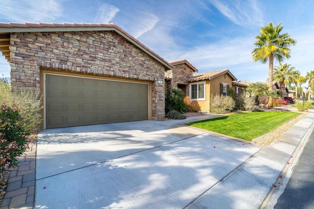 view of front facade featuring a garage and a front yard