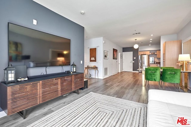 living room with light hardwood / wood-style flooring