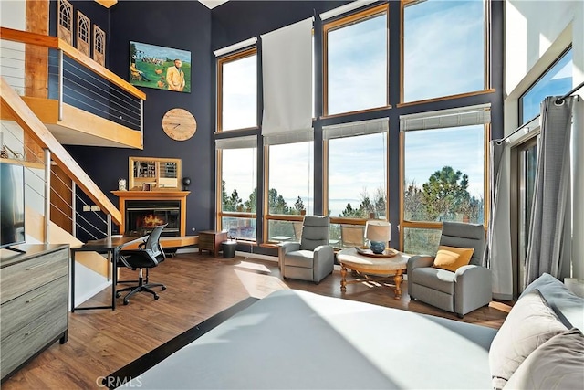 office area featuring wood-type flooring and a high ceiling