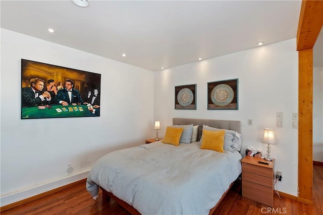 bedroom featuring dark hardwood / wood-style flooring