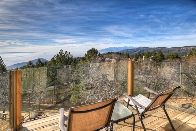 wooden terrace featuring a mountain view