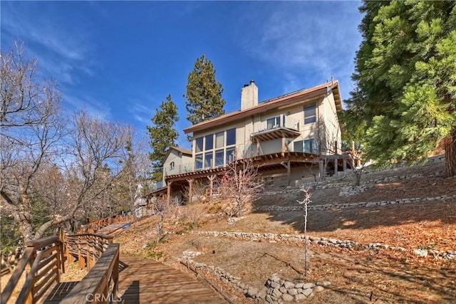 back of property featuring a sunroom