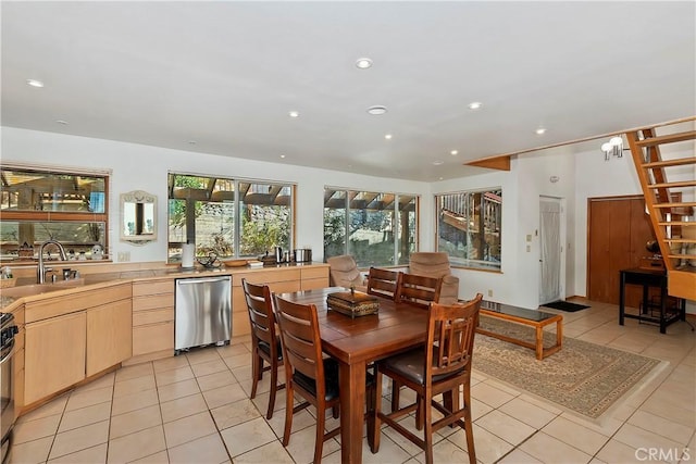 dining area with light tile patterned flooring and sink