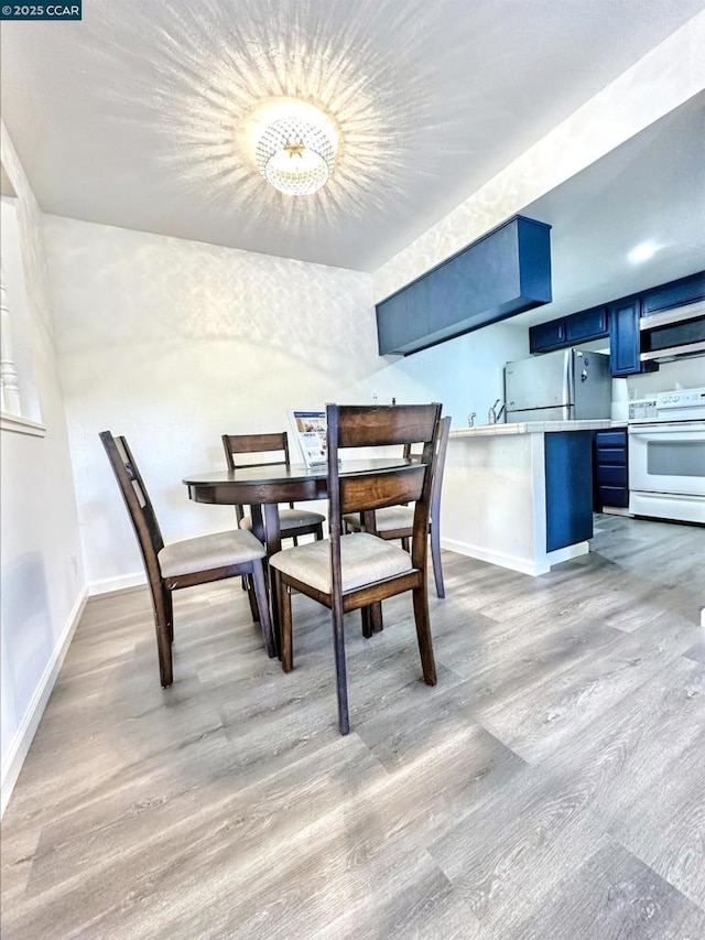 dining area with light wood-type flooring