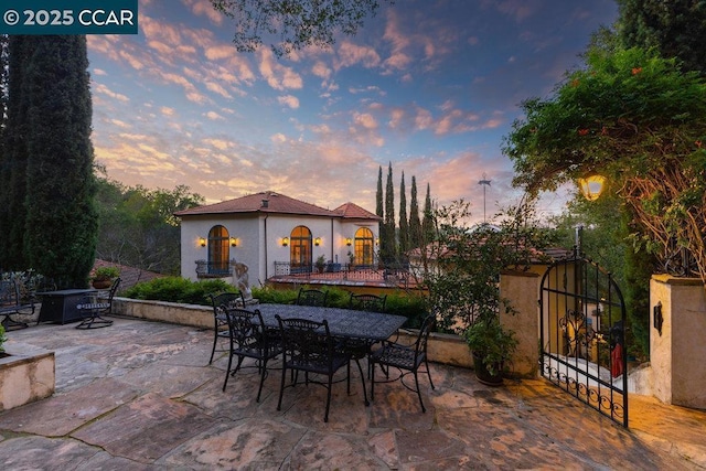 view of patio terrace at dusk