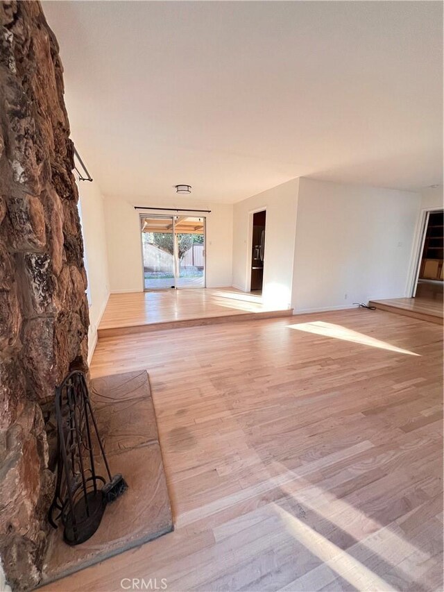 unfurnished living room featuring light hardwood / wood-style flooring